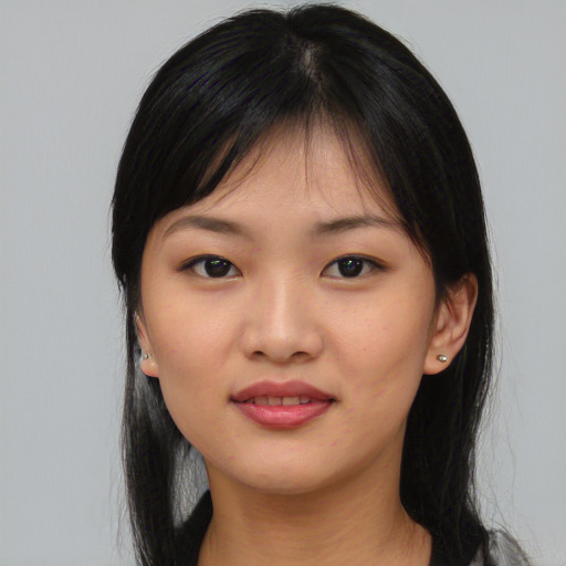 Joyful asian young-adult female with medium  black hair and brown eyes