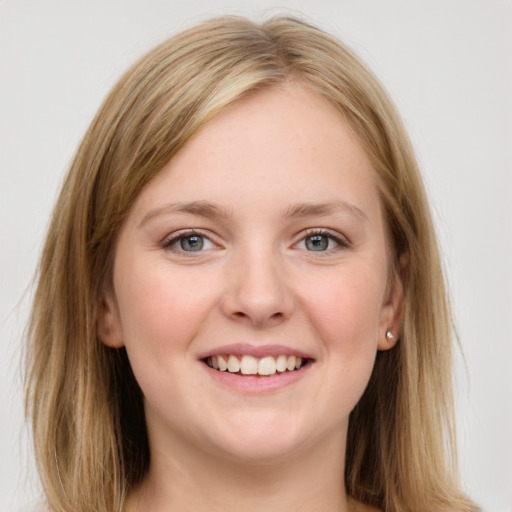 Joyful white young-adult female with medium  brown hair and blue eyes