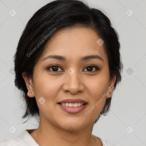 Joyful latino young-adult female with medium  brown hair and brown eyes