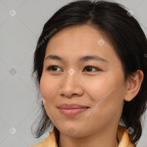 Joyful asian young-adult female with medium  brown hair and brown eyes