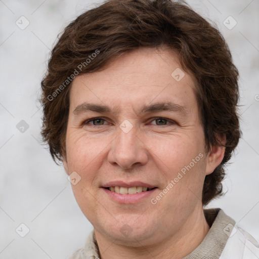 Joyful white adult female with short  brown hair and grey eyes