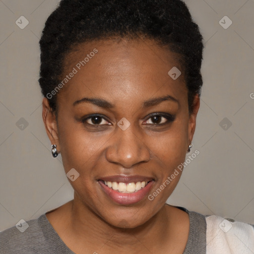 Joyful black young-adult female with short  brown hair and brown eyes