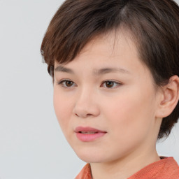 Joyful white child female with medium  brown hair and brown eyes