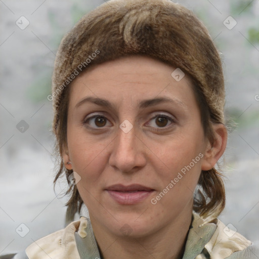 Joyful white adult female with medium  brown hair and grey eyes