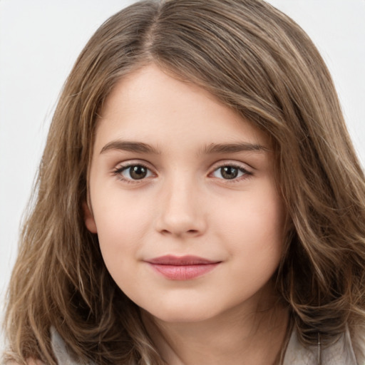 Joyful white child female with long  brown hair and brown eyes