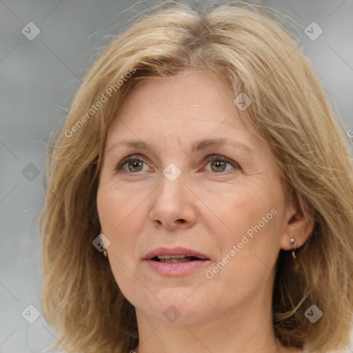 Joyful white adult female with medium  brown hair and grey eyes