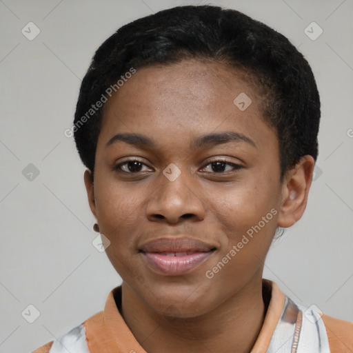 Joyful black young-adult female with short  black hair and brown eyes