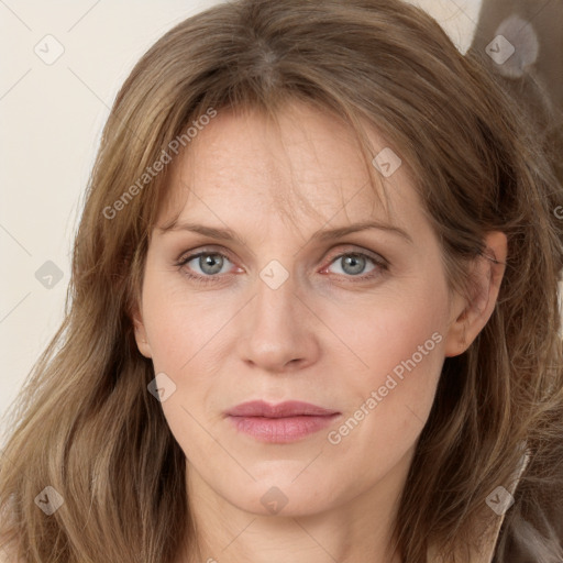 Joyful white adult female with long  brown hair and grey eyes