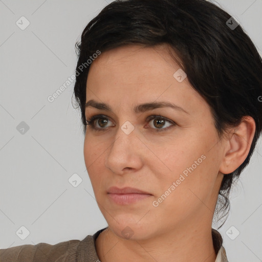 Joyful white adult female with short  brown hair and brown eyes