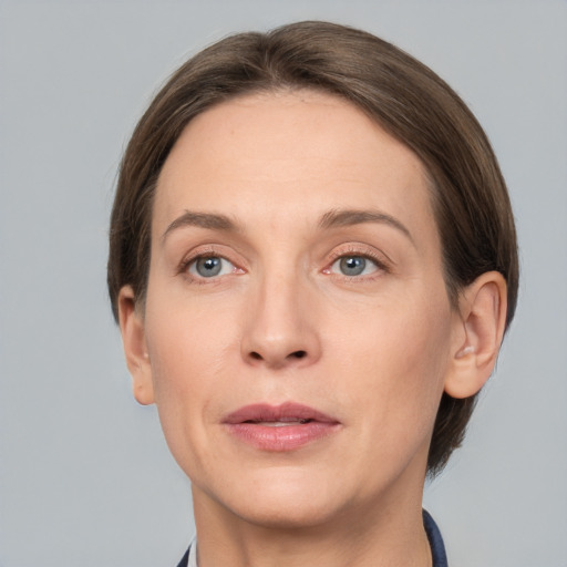 Joyful white adult female with short  brown hair and grey eyes