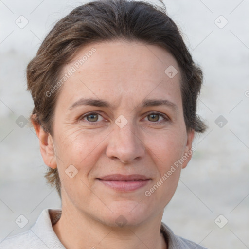 Joyful white adult female with short  brown hair and brown eyes