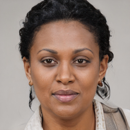Joyful latino adult female with short  brown hair and brown eyes