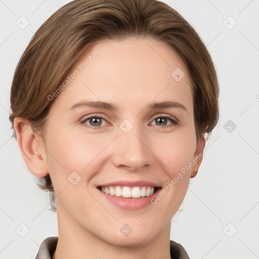 Joyful white young-adult female with short  brown hair and grey eyes