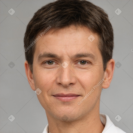 Joyful white adult male with short  brown hair and brown eyes