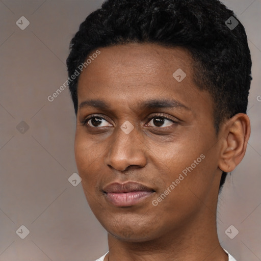 Joyful black young-adult male with short  black hair and brown eyes