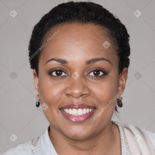 Joyful black young-adult female with short  black hair and brown eyes