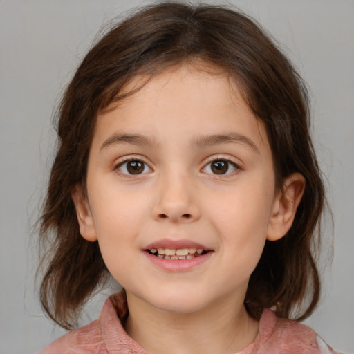 Joyful white child female with medium  brown hair and brown eyes