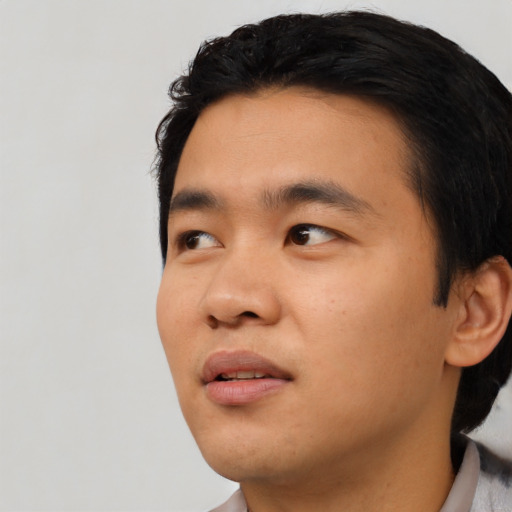 Neutral asian young-adult male with short  black hair and brown eyes
