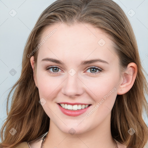 Joyful white young-adult female with medium  brown hair and blue eyes