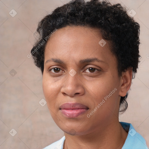 Joyful black adult female with short  brown hair and brown eyes