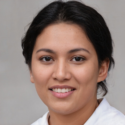 Joyful asian young-adult female with medium  brown hair and brown eyes