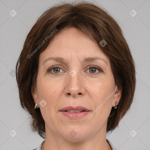 Joyful white adult female with medium  brown hair and grey eyes