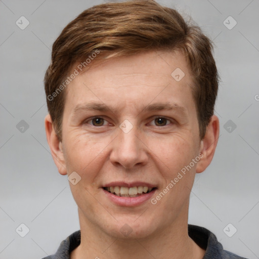 Joyful white adult male with short  brown hair and grey eyes