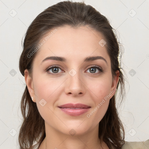 Joyful white young-adult female with medium  brown hair and grey eyes