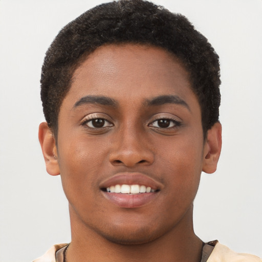 Joyful black young-adult male with short  brown hair and brown eyes