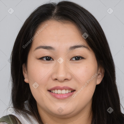 Joyful asian young-adult female with long  brown hair and brown eyes