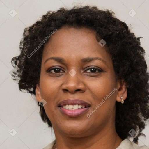 Joyful black adult female with short  brown hair and brown eyes