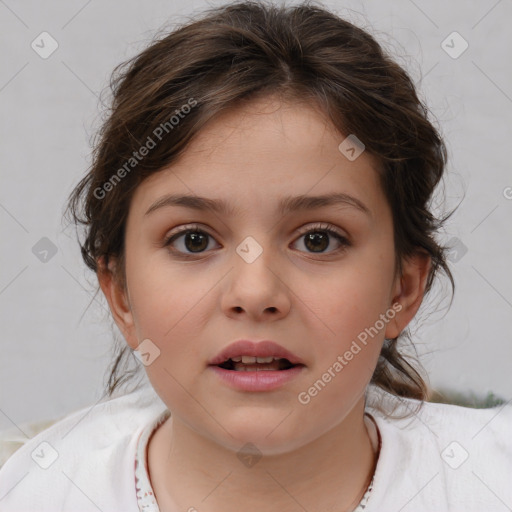 Joyful white child female with medium  brown hair and brown eyes