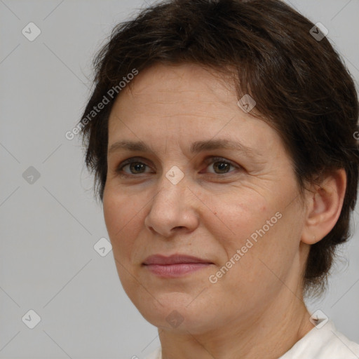 Joyful white adult female with short  brown hair and brown eyes