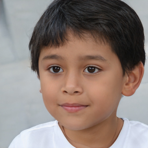 Joyful asian child male with short  brown hair and brown eyes