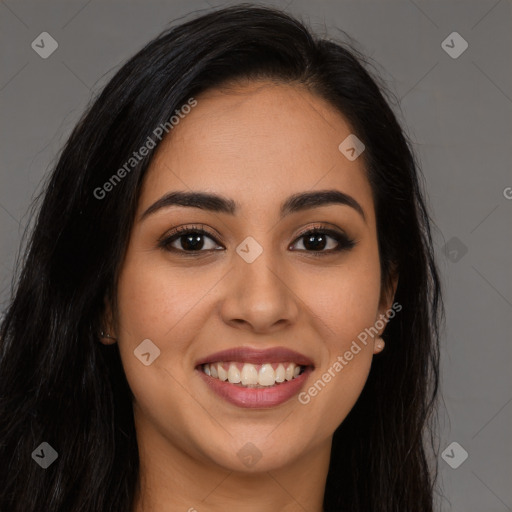 Joyful latino young-adult female with long  brown hair and brown eyes