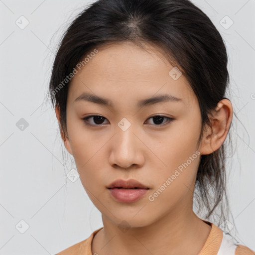 Neutral asian young-adult female with medium  brown hair and brown eyes