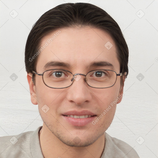 Joyful white young-adult male with short  brown hair and grey eyes