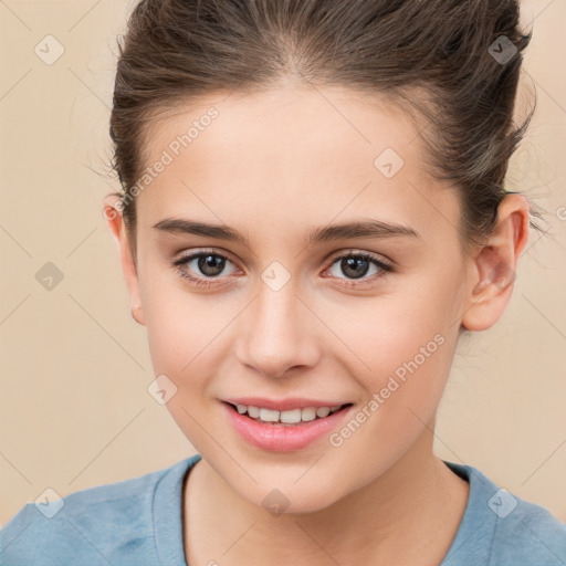 Joyful white child female with short  brown hair and brown eyes