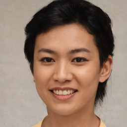 Joyful asian young-adult female with short  brown hair and brown eyes