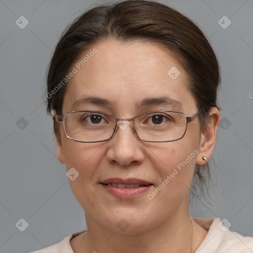 Joyful white adult female with medium  brown hair and brown eyes