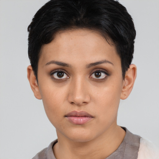 Neutral latino young-adult female with short  black hair and brown eyes