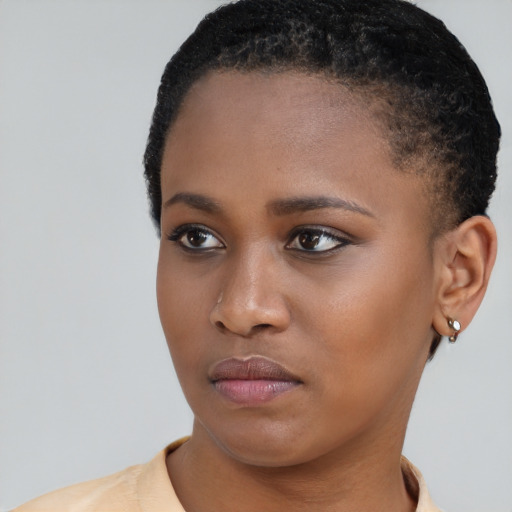 Neutral black young-adult female with short  brown hair and brown eyes