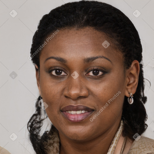 Joyful black young-adult female with long  brown hair and brown eyes