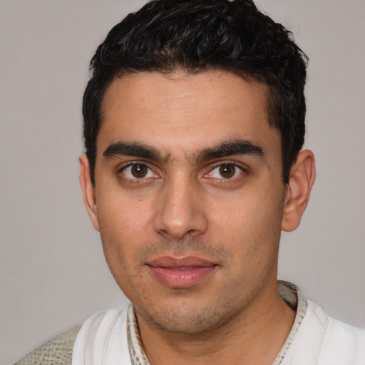 Neutral white young-adult male with short  black hair and brown eyes