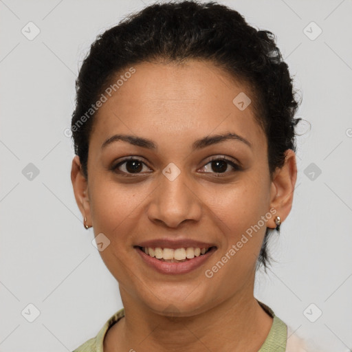 Joyful latino young-adult female with short  brown hair and brown eyes