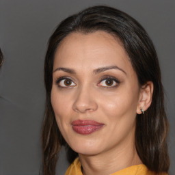 Joyful white young-adult female with medium  brown hair and brown eyes