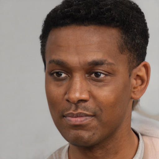 Neutral black young-adult male with short  black hair and brown eyes
