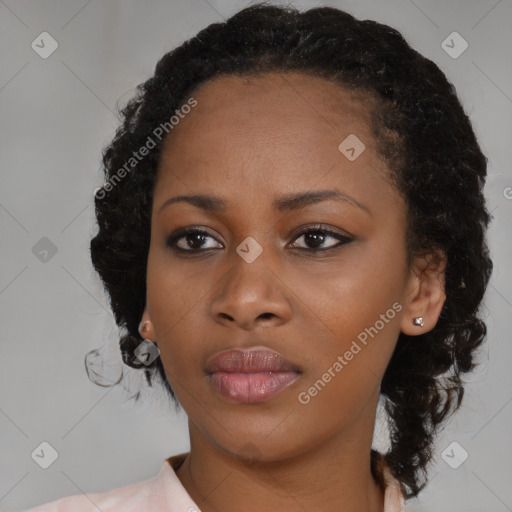 Joyful black young-adult female with medium  black hair and brown eyes