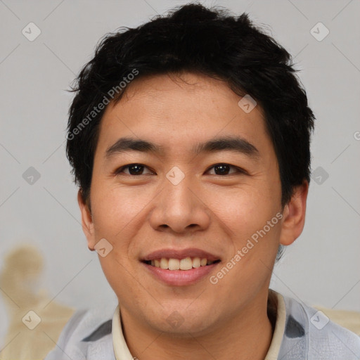 Joyful asian young-adult male with short  black hair and brown eyes