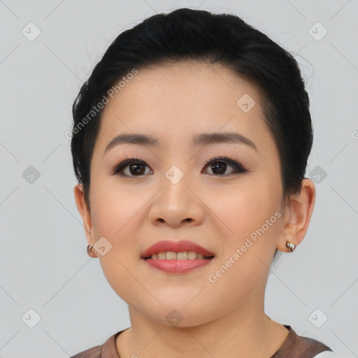 Joyful asian young-adult female with short  black hair and brown eyes